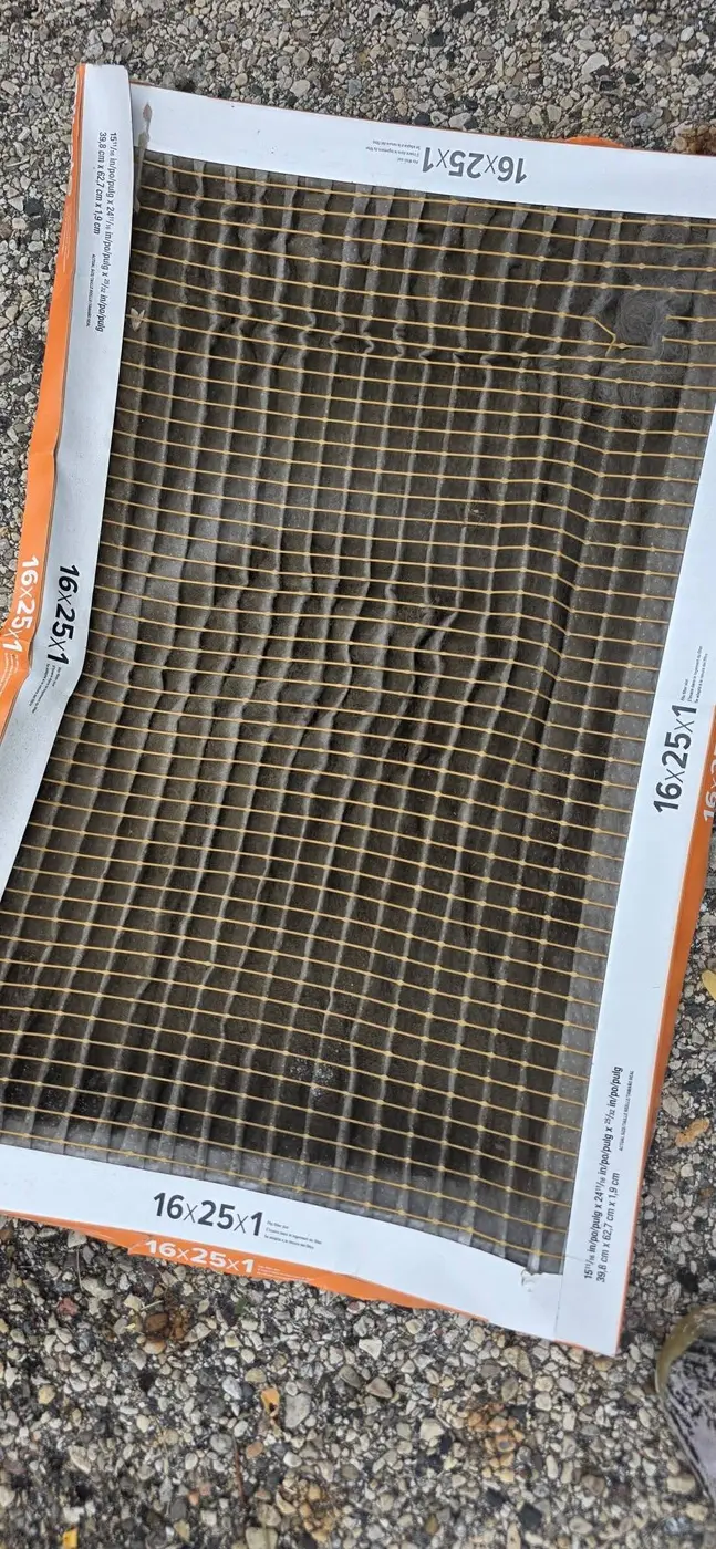 Severely clogged 16x25x1 furnace filter pulled from a customer's system