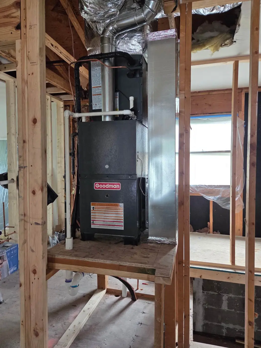 New Goodman furnace installed with fresh sheet metal plenums